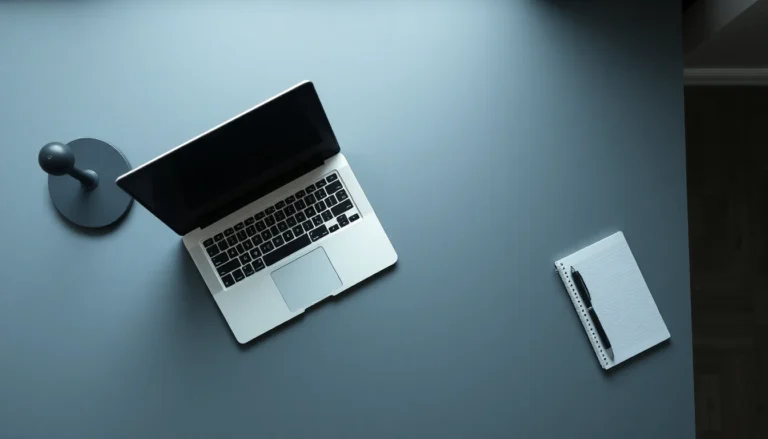 A laptop and notepad on a clean desk in natural light